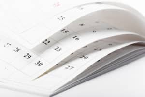 Close-up of calendar pages flipping