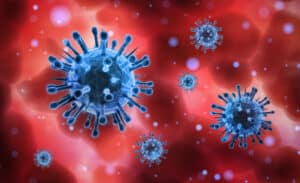 Close-up of blue coronavirus, red bacground