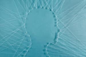 String art depicting head profile on blue background
