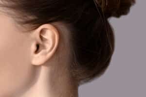 Closeup of young womans ear